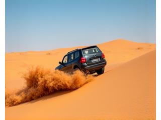 4x4 vehicle in vast desert dunes