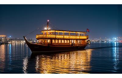 Traditional Dhow boat on Khalid Lagoon at night